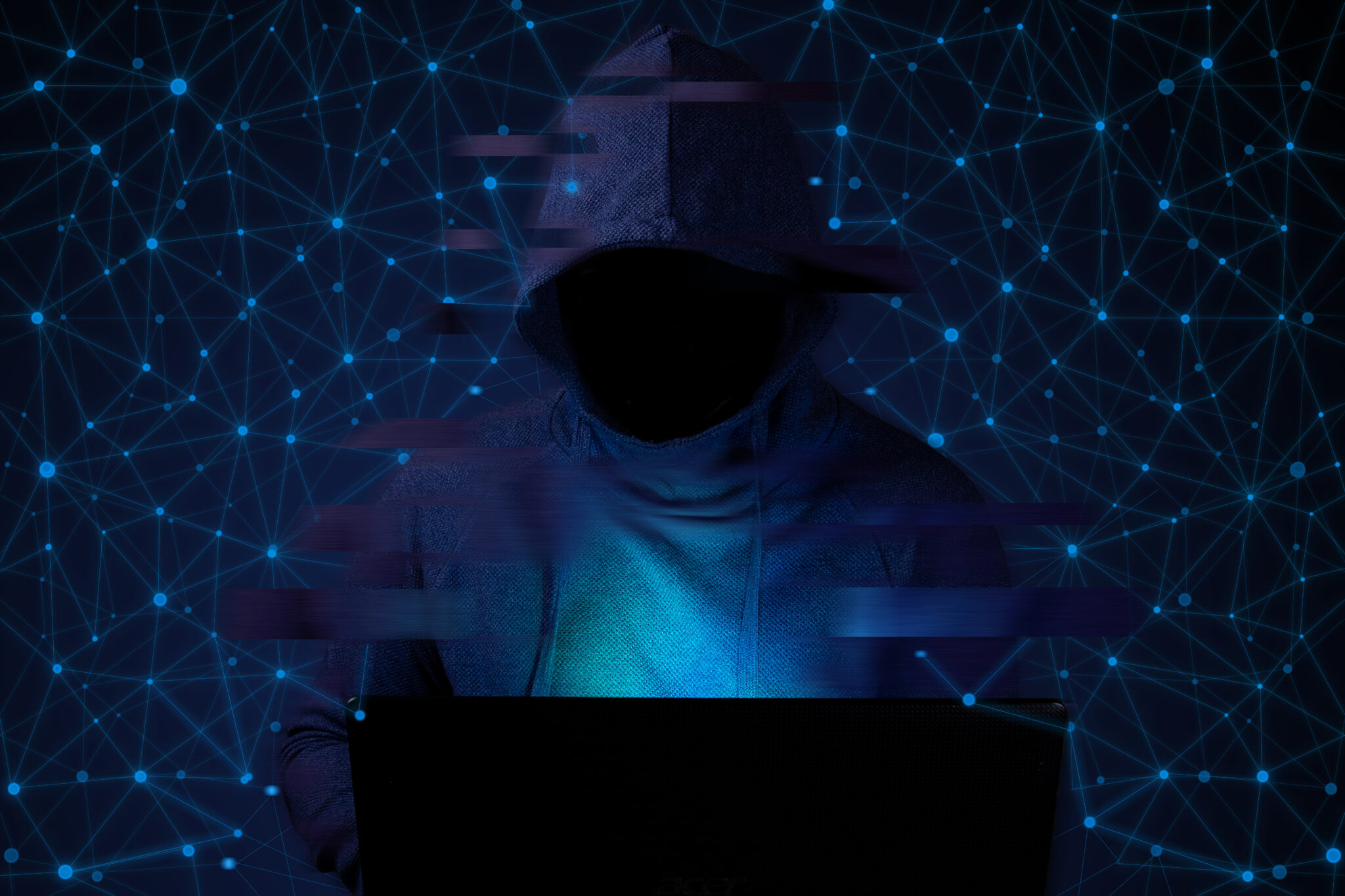 Hacker,With,A,Computer,On,The,Background,Of,The,Internet