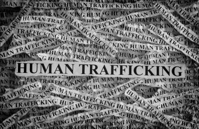 Human,Trafficking.,Torn,Pieces,Of,Paper,With,The,Words,Human